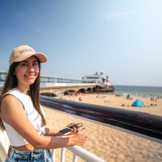 girl in front of a beach in bournemouth