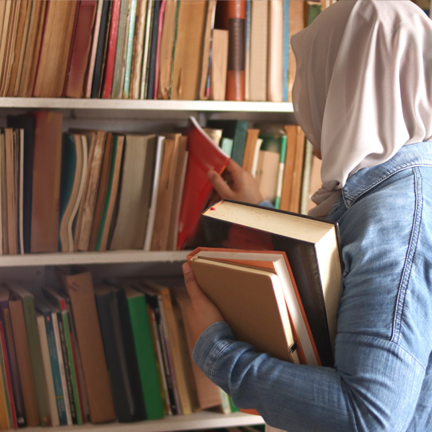  picking book in bookshelf