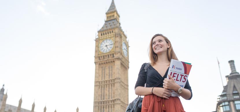 Girl with a brochure in front of Big Ben