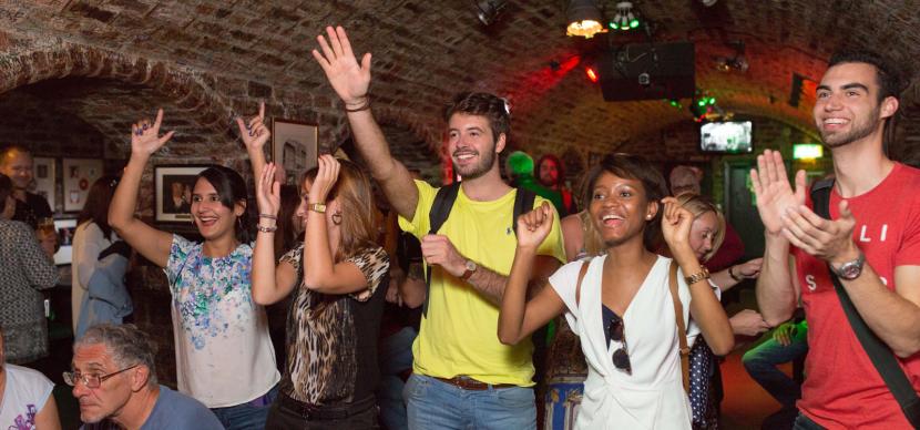 people cheering in a bar