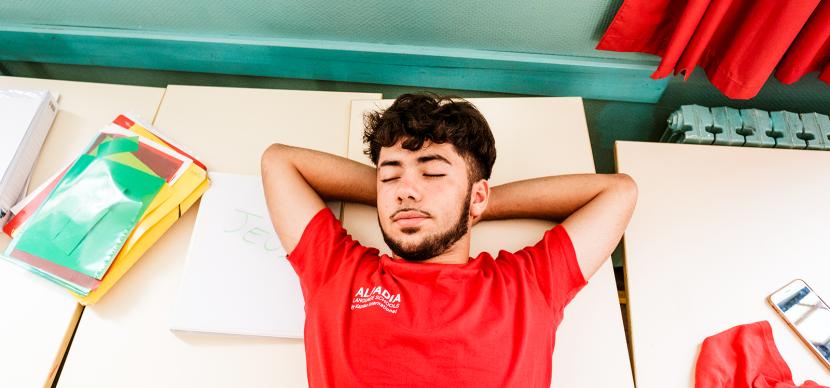 Student sleeping on the floor