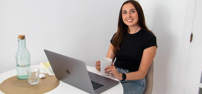 student in front of her laptop at home