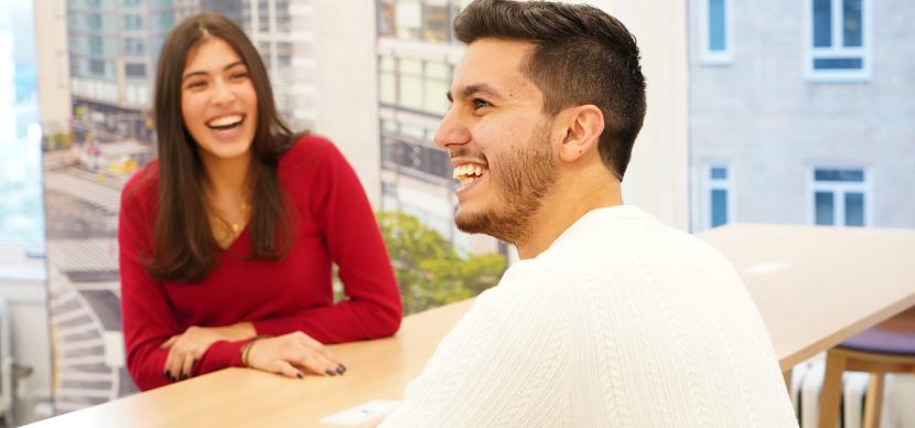 two students laughing together