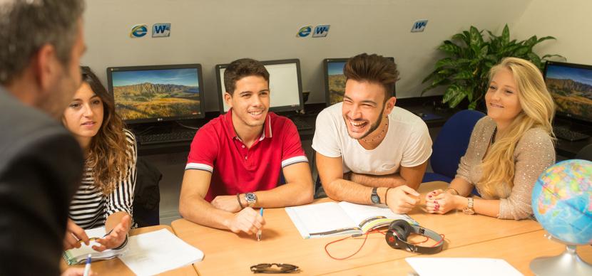 students talking at a table