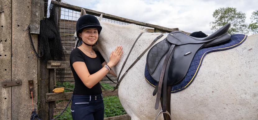 student with a horse