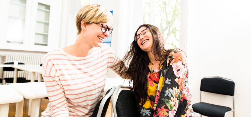 two students laughing together