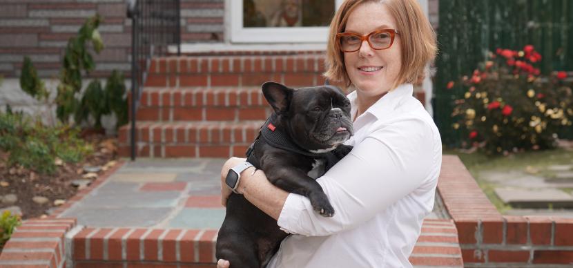 woman holding a dog