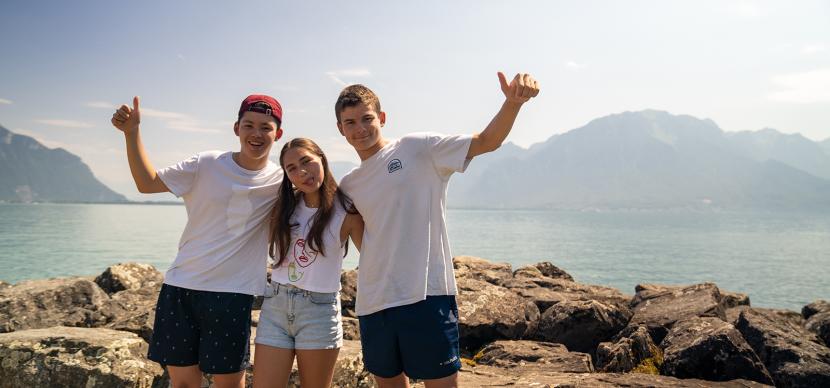 students in front of the lake