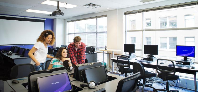 students looking at a screen in a classroom