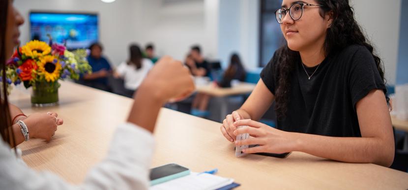 student chatting with somebody in the school