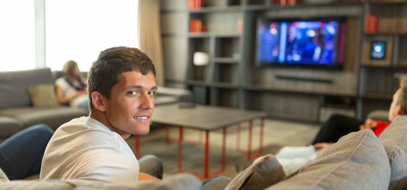 student watching tv in a host family