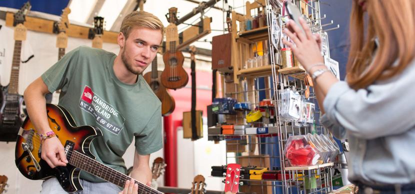 student playing guitar