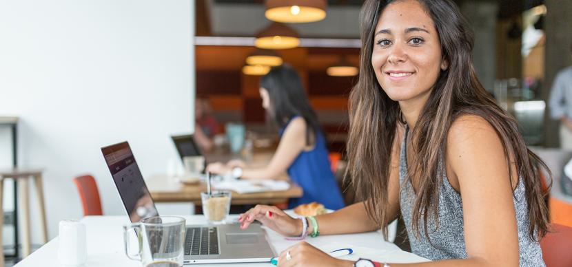 student working in a coffee shop