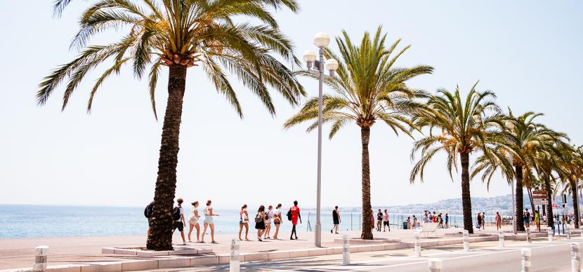 students walking near the beach