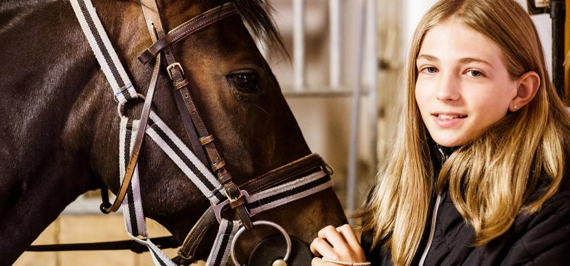 student with a horse