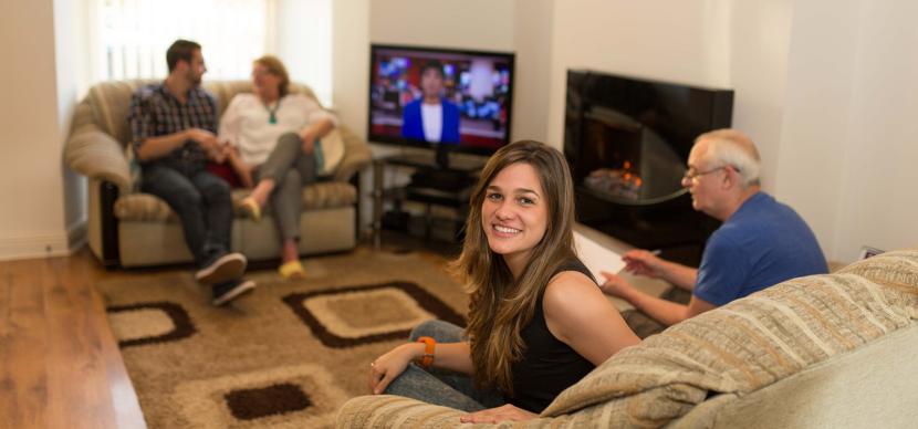 student in her host family living-room