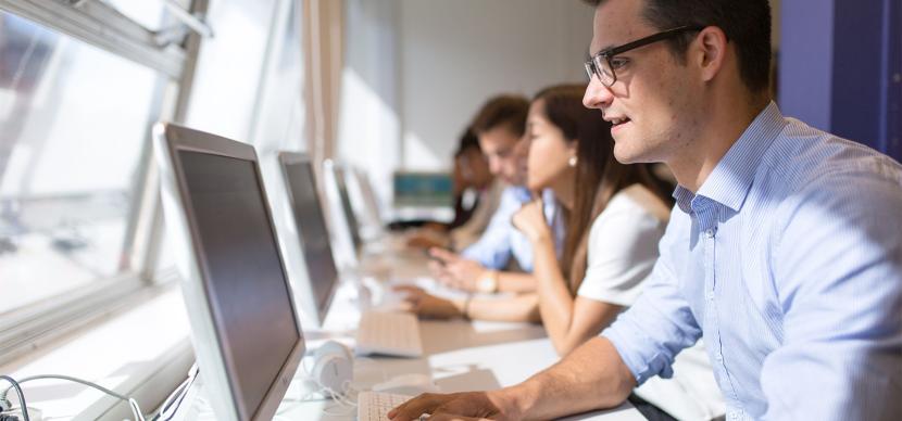 student looking at the screen of his computer