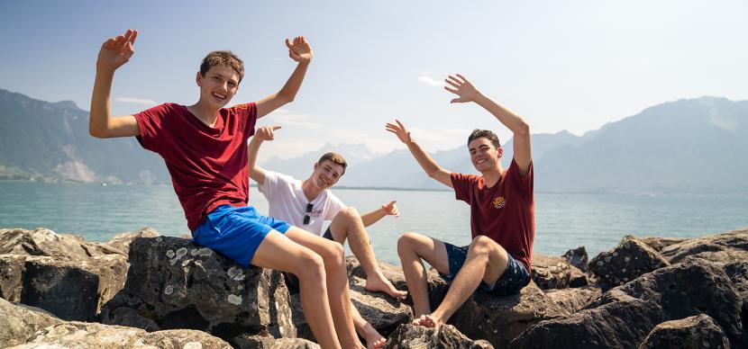 students next to the lake