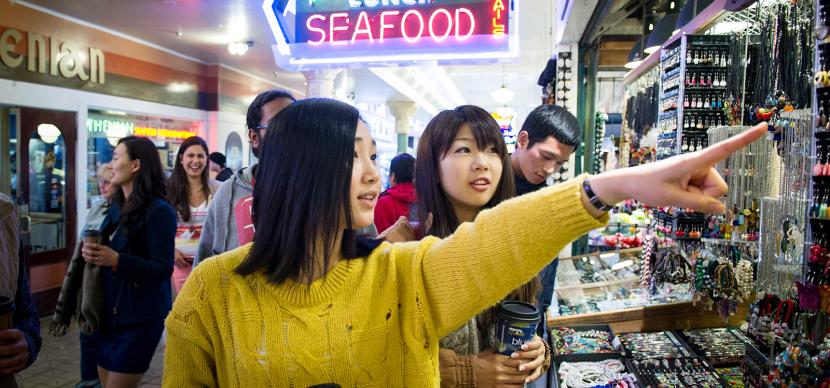 two students pointing at something