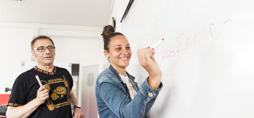 student writing on the board