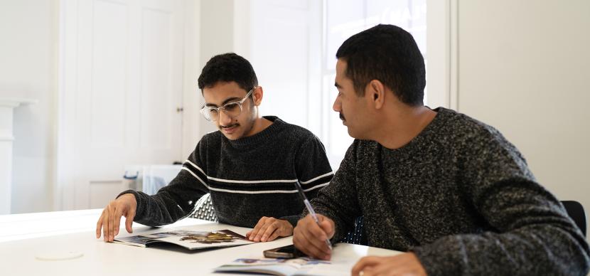 two students working together in classroom