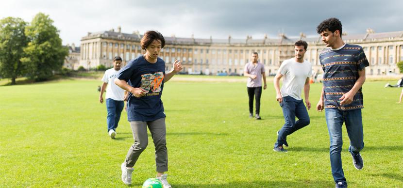 students playing soccer in bath