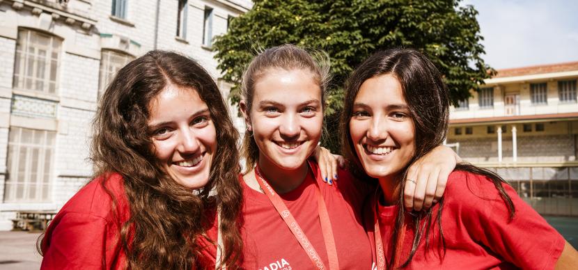 3 students smiling at the camera