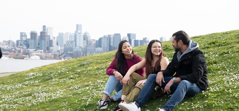 3 students on grass at seattle