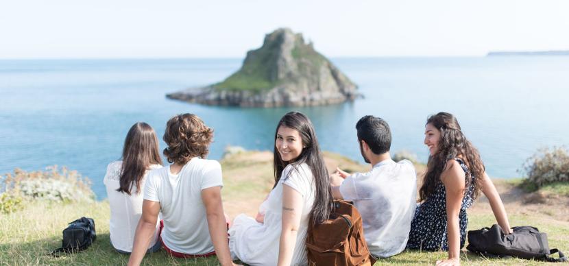 students in torquay looking at the sea
