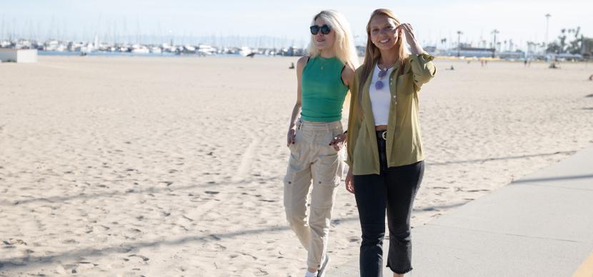 two girls walking on a beach in santa barbara