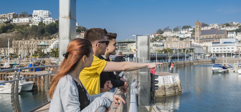 students looking at the pier