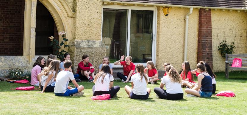 students chilling under the sun in brighton campus