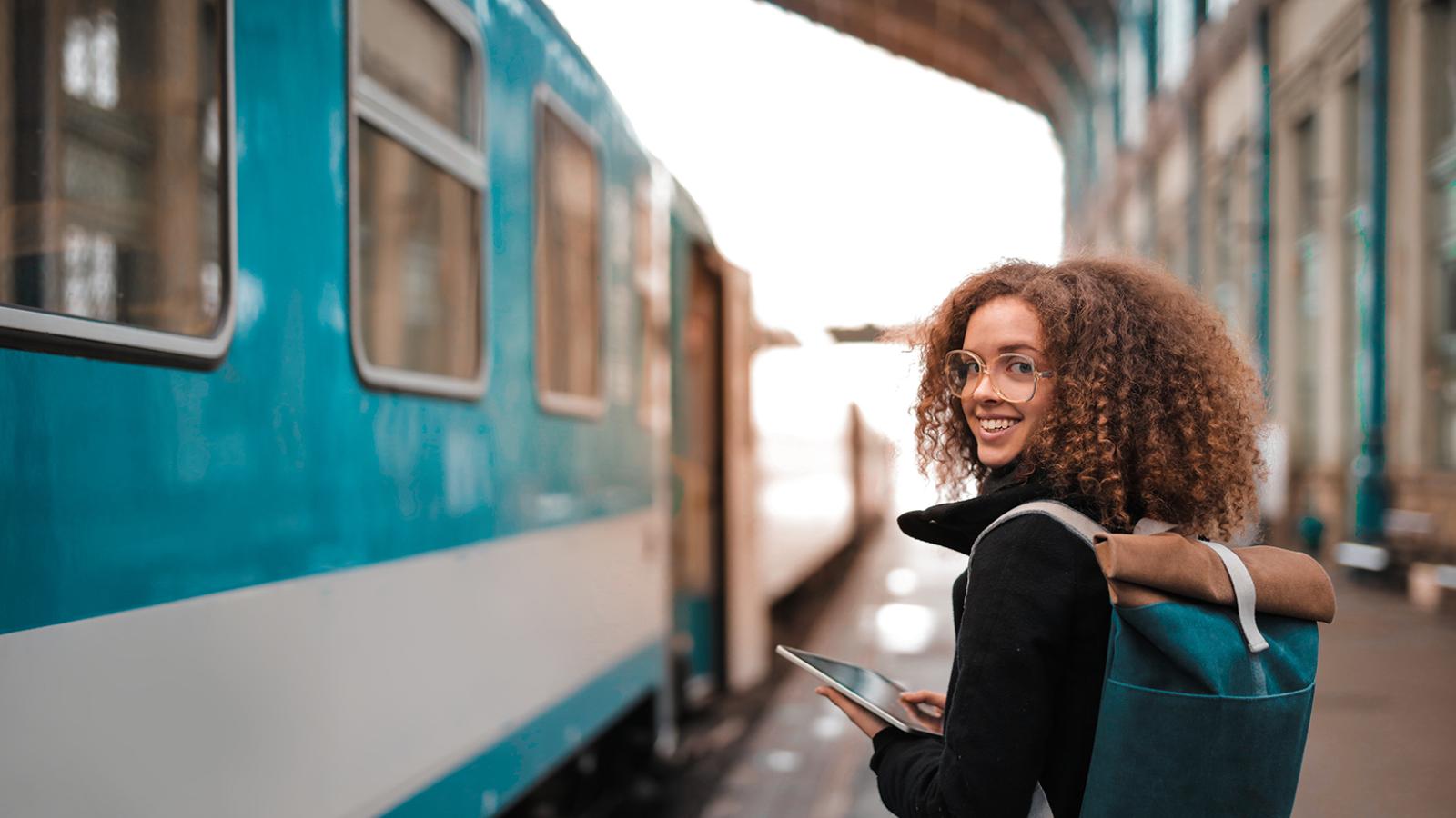 student in front of a train