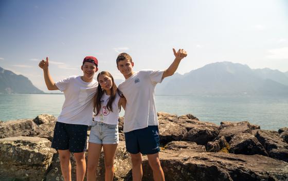 students in front of the lake