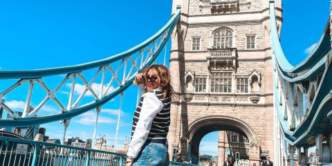 Girl standing in front of Tower Bridge