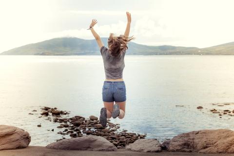 ireland-student-jumping-in-front-of-lake.jpg