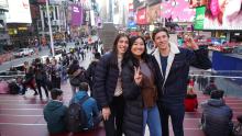 students on times square doing a picture