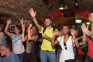 people cheering in a bar