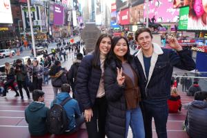 students on times square doing a picture