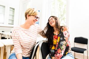 two students laughing together