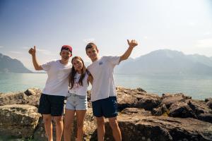 students in front of the lake