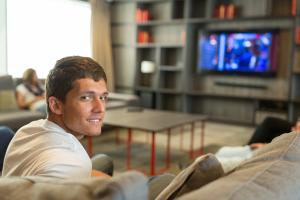 student watching tv in a host family