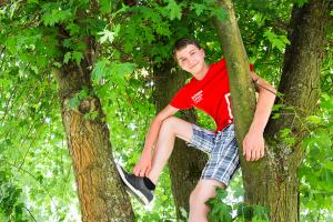 student in a tree