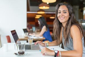 student working in a coffee shop