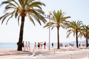 students walking near the beach