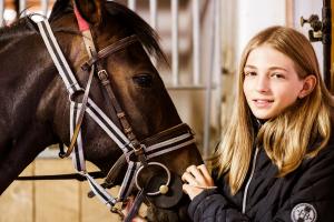 student with a horse