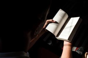 student reading books