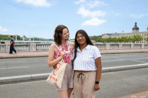 two students on a bridge in Lyon