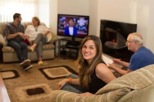 student in her host family living-room