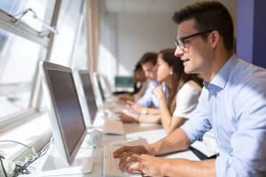 student looking at the screen of his computer